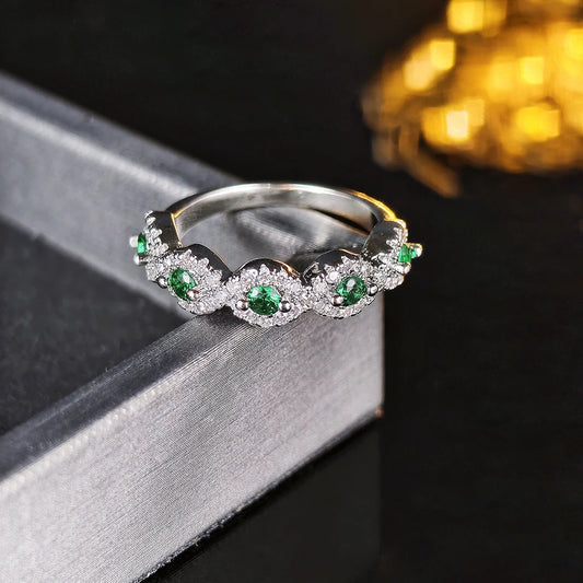 MyClosetAid silver ring eternity band with round green gemstones and small clear crystals