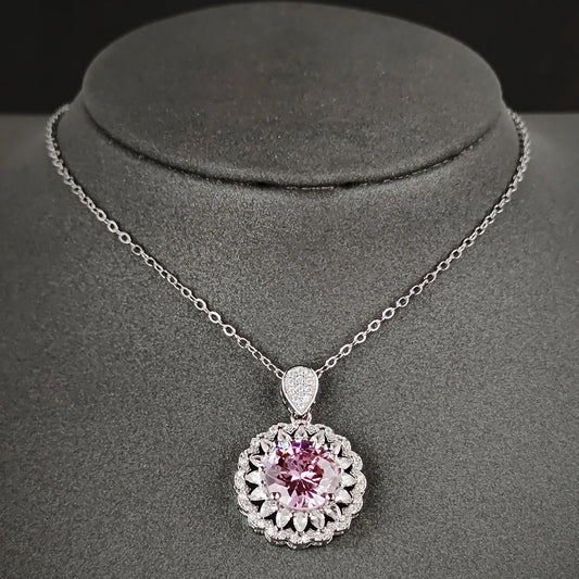 MyClosetAid sterling silver necklace with a round pink gemstone surrounded by small clear stones on a delicate chain