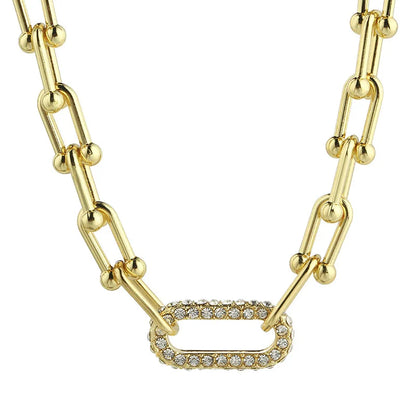 Gold chain necklace with diamond-studded link showcasing diamond jewelry engagement rings style