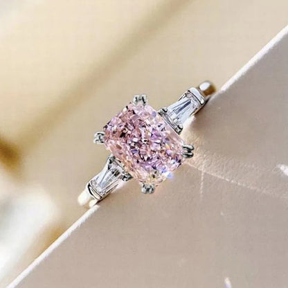 MyClosetAid pink cubic zirconia ring with a rectangular center stone and baguette side stones