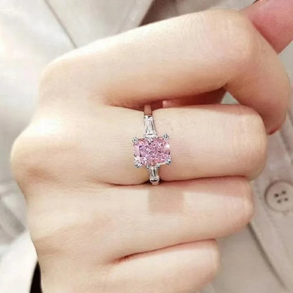 MyClosetAid pink cubic zirconia ring on finger with silver band and rectangular stone